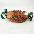 Gourmet gift basket with cookies, chocolates, and nuts on a white background