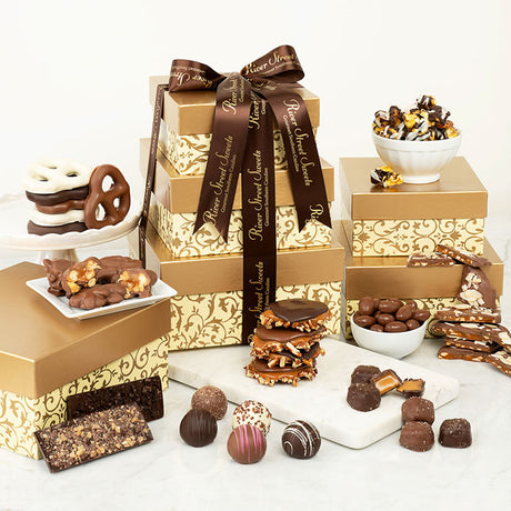 Assorted chocolates and gift boxes with decorative ribbons on a white background