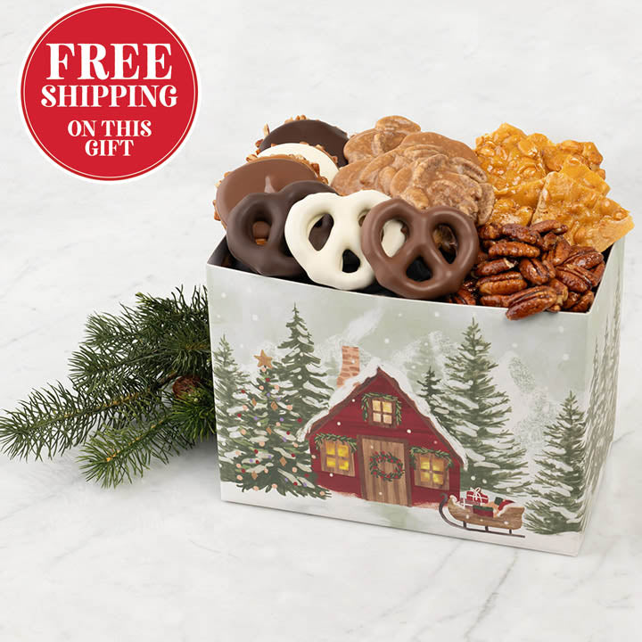 Box of assorted snacks with a Christmas-themed design on a white background